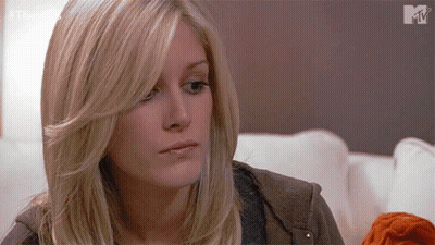 Blonde Woman Sitting On Couch GIF
