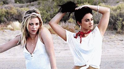 Blonde Woman Sitting With Another Woman GIF