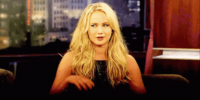 Blonde Woman Sitting With Hands On Hips GIF