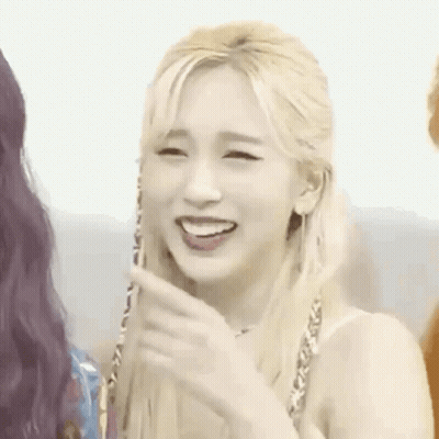 Blonde Woman Smiling And Pointing GIF