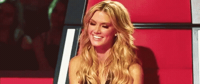 Blonde Woman Smiling In Chair GIF