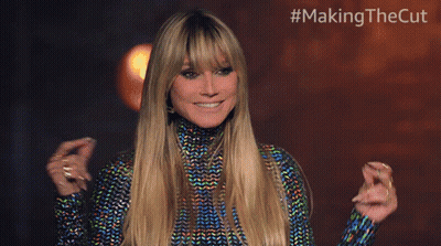 Blonde Woman Smiling In Front Of #MakingTheCut Sign GIF