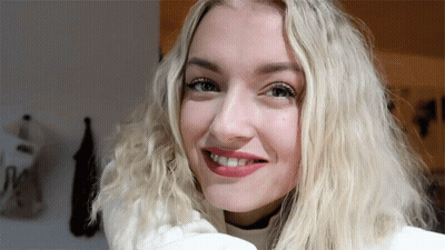 Blonde Woman Smiling In White Shirt GIF