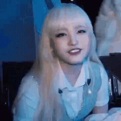 Blonde Woman Smiling In White Shirt And Vest GIF