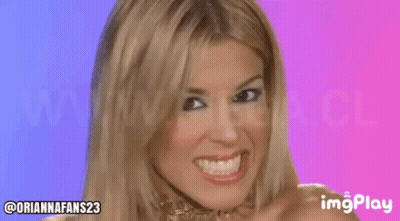 Blonde Woman Smiling Making Funny Face Purple Background GIF