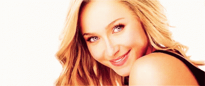 Blonde Woman Smiling Over Shoulder GIF