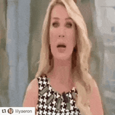 Blonde Woman Surprised In Black-And-White Dress GIF