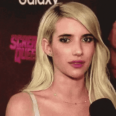 Blonde Woman Talking Into Microphone GIF