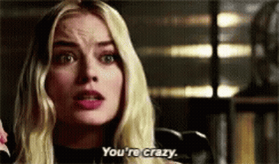 Blonde Woman Talking On Phone Saying You're Crazy GIF