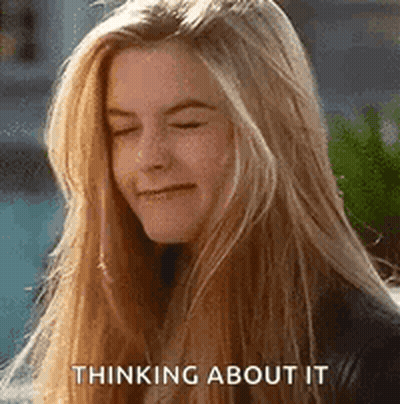 Blonde Woman Thinking And Smiling GIF