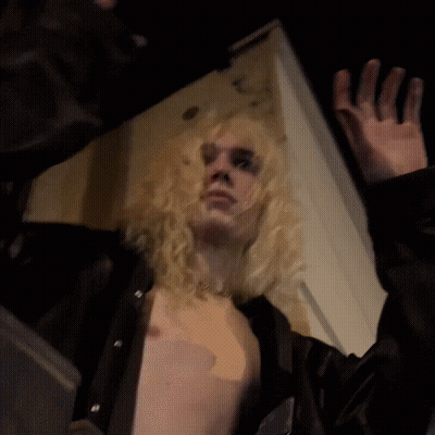 Blonde Woman With 666 Necklace GIF