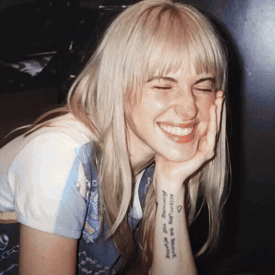 Blonde Woman With Always On Your Mind Tattoo GIF