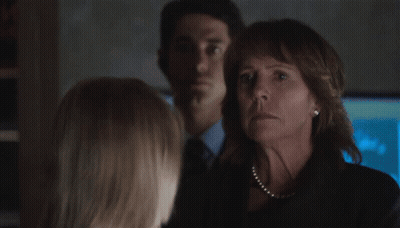 Blonde Woman With Green Eyes Looking At Camera GIF