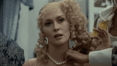 Blonde Woman With Pearl Necklace Getting Hair Done GIF