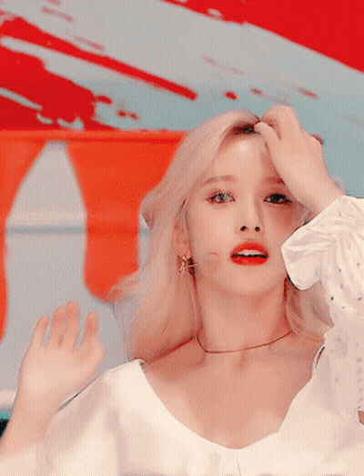 Blonde Woman With Red Lips White Shirt Earrings GIF