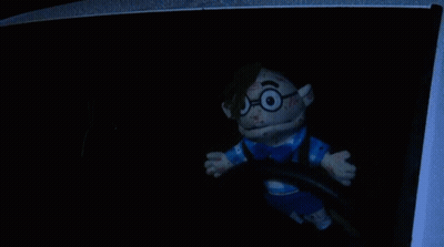 Bloodied Stuffed Toy With Glasses And Blue Shirt GIF