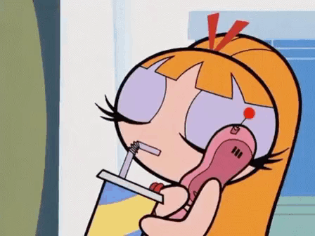 Blossom From The Powerpuff Girls Is Talking On A Cell Phone With A Straw . GIF