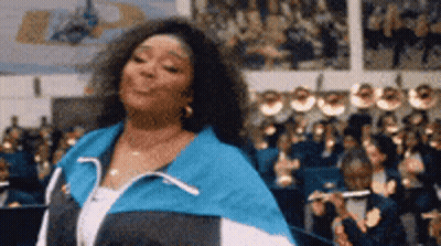 Blue And White Jacket Woman Dancing Before Crowd GIF