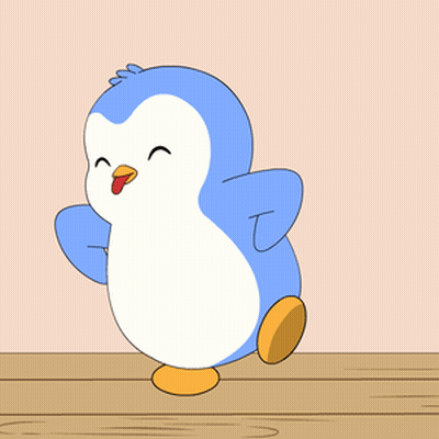 Blue and White Penguin on Wooden Table