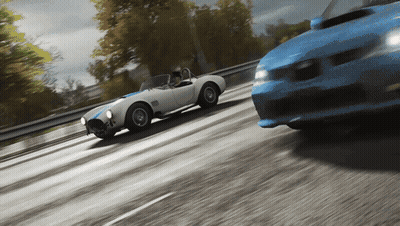 Blue And White Sports Car On Highway GIF