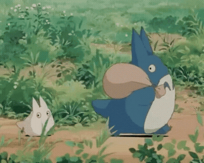 Blue And White Totoro Holding Bag In Mouth With Smaller Totoro GIF