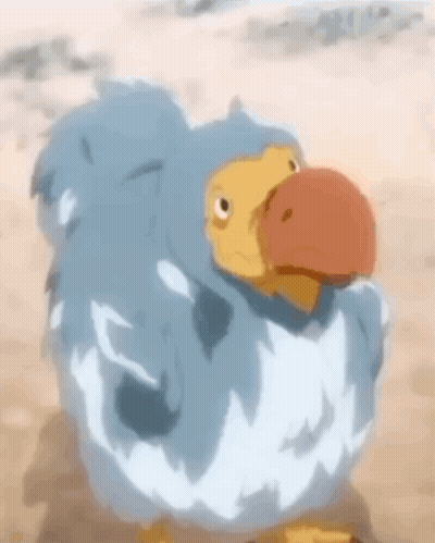 Blue And Yellow Cartoon Bird On Sandy Beach GIF
