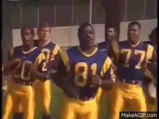 Blue And Yellow Football Players Standing In Line GIF