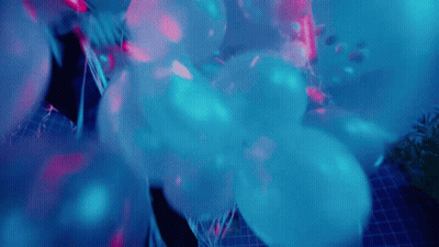 Blue Balloons Floating In Dark Room GIF