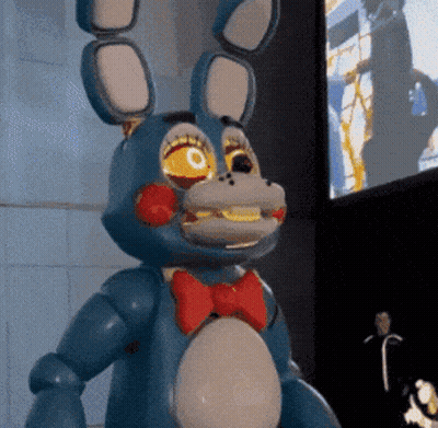Blue Bunny With Red Bow Tie And Yellow Eyes GIF