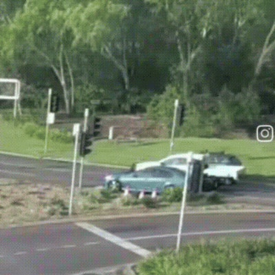 Blue Car And White Car Driving GIF