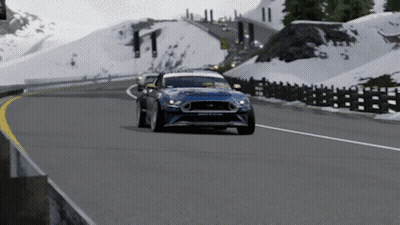 Blue Car Driving On Road With Sign O GIF