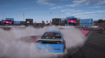 Blue Car Driving On Track With Smoke GIF