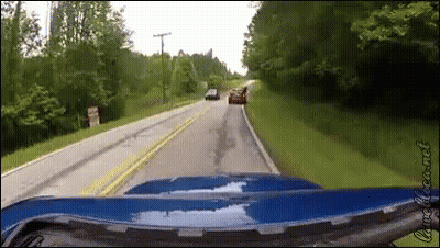 Blue Car Driving Past Do Not Enter Sign GIF