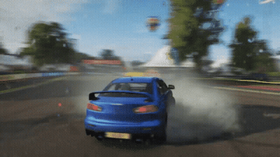 Blue Car Driving Past Trees Hot Air Balloon GIF
