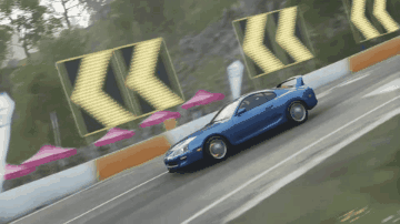 Blue Car Driving With Arrows Pointing Right GIF