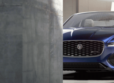 Blue Car With Jaguar Logo GIF