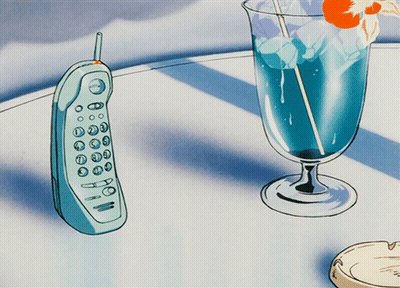 Blue Cell Phone Next To Glass Of Blue Liquid GIF