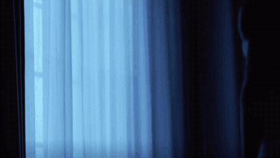 Blue Curtain With Light Through Window GIF