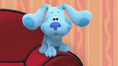 Blue Dog Sitting On Red Couch GIF