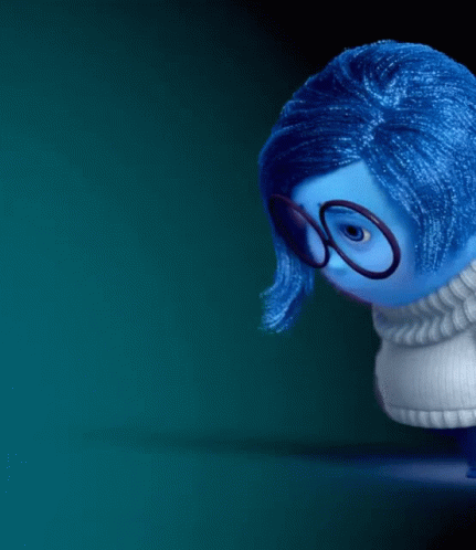 Blue Doll With Glasses Looking Down GIF