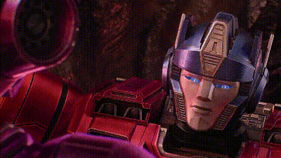 Blue-Eyed Robot In Front Of Yellow Robot GIF