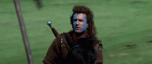 Blue-Faced Man Riding Horse With Sword GIF