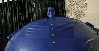 Blue-Faced Woman In Blue Jacket GIF