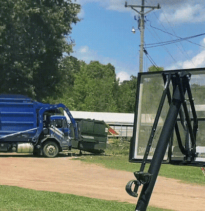 Blue Garbage Truck Next To Basketball Net GIF