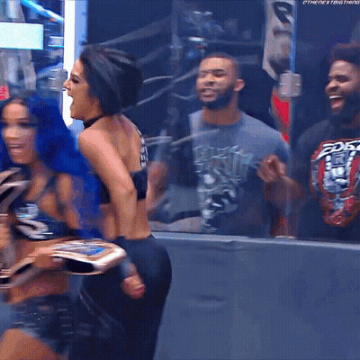 Blue Hair Woman Hugging Another Woman In Wrestling Ring Shirt Says Pay Off GIF