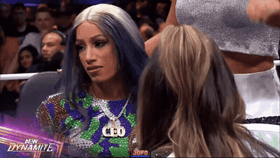 Blue Hair Woman With CEO Necklace In Wrestling Ring GIF