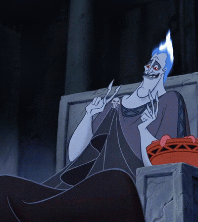Blue-Haired Cartoon Character Eating Cupcake On Throne GIF