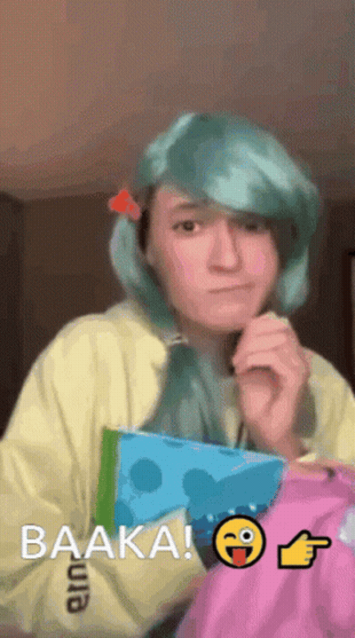 Blue-Haired Girl Holding Book Saying Baaka GIF