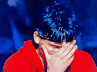 Blue-Haired Man Covering Face GIF