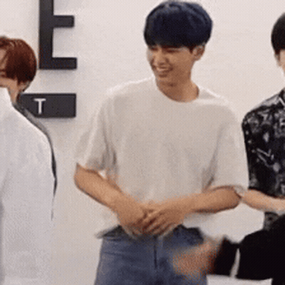Blue-Haired Man Smiling Beside Another Man GIF